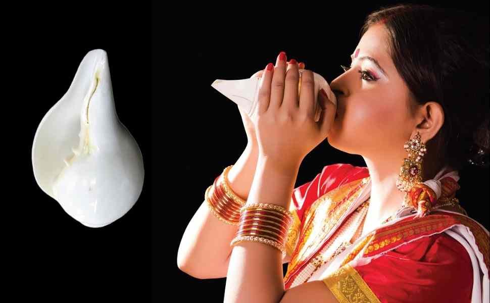 Blowing a conch shell 11zon Blowing a conch shell 11zon