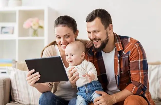 family parenthood people concept happy mother father showing tablet pc computer baby home 380164 194591 தனது குடிமக்களுக்கு மாதம் ரூ.25000 வழங்கும் நாடு..! இந்த சூப்பர் திட்டம் பற்றி தெரிஞ்சுக்கோங்க..!